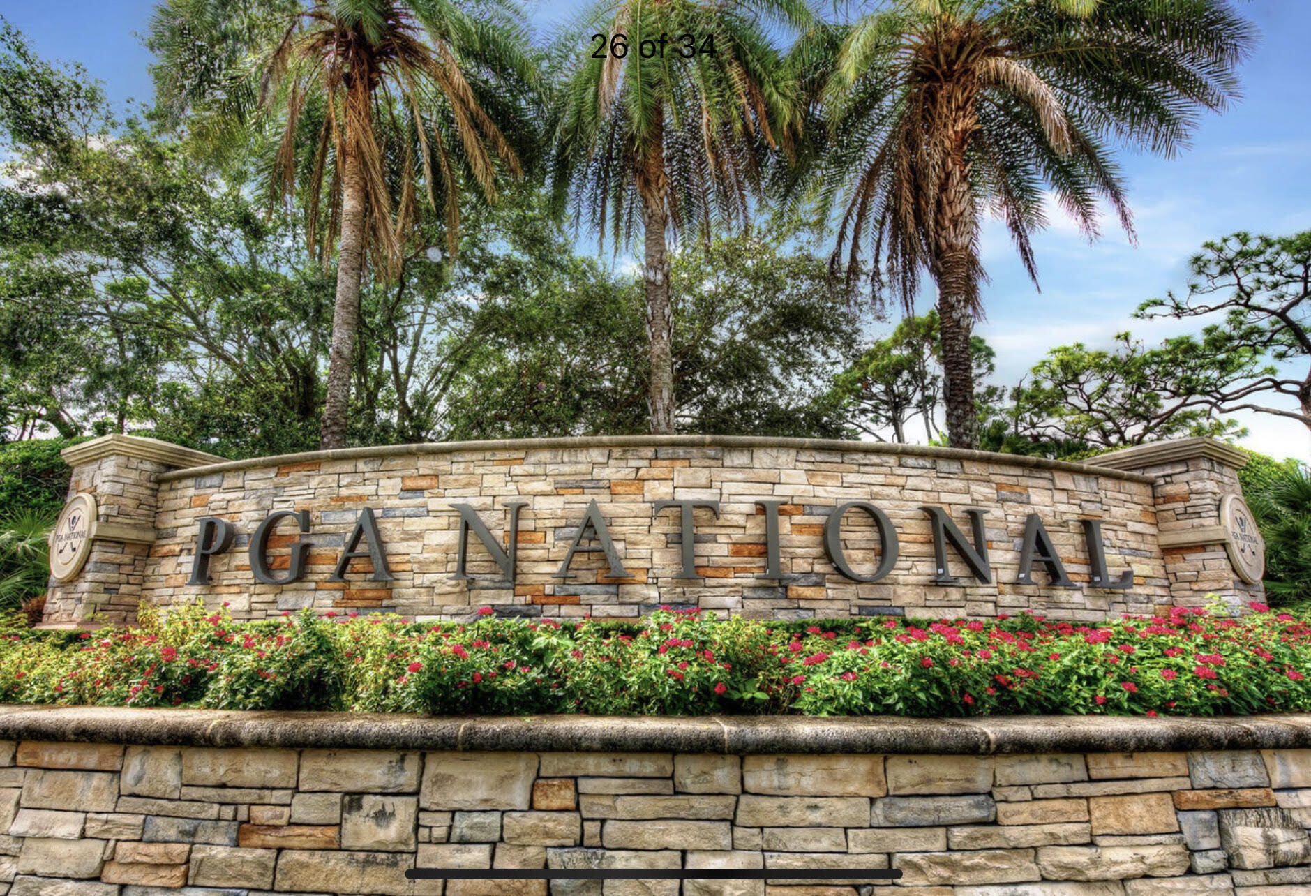 356 Prestwick Circle, Unit 3 Palm Beach Gardens, FL 33418 - Photo 41 of 42 a street sign that is sitting in front of a lake