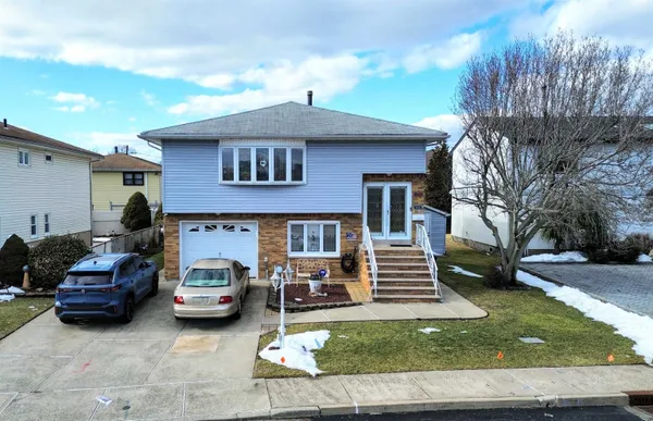 a view of a car park in front of house