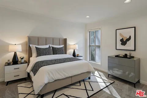 a bedroom with a bed and lamp