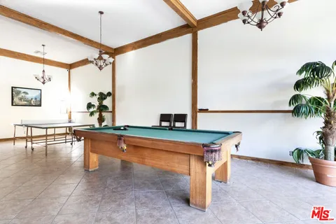 a room with table and chairs