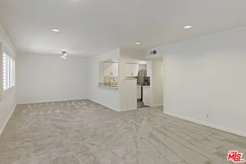 a view of a livingroom with wooden floor