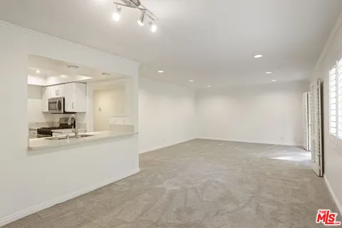 a view of kitchen with wooden floor