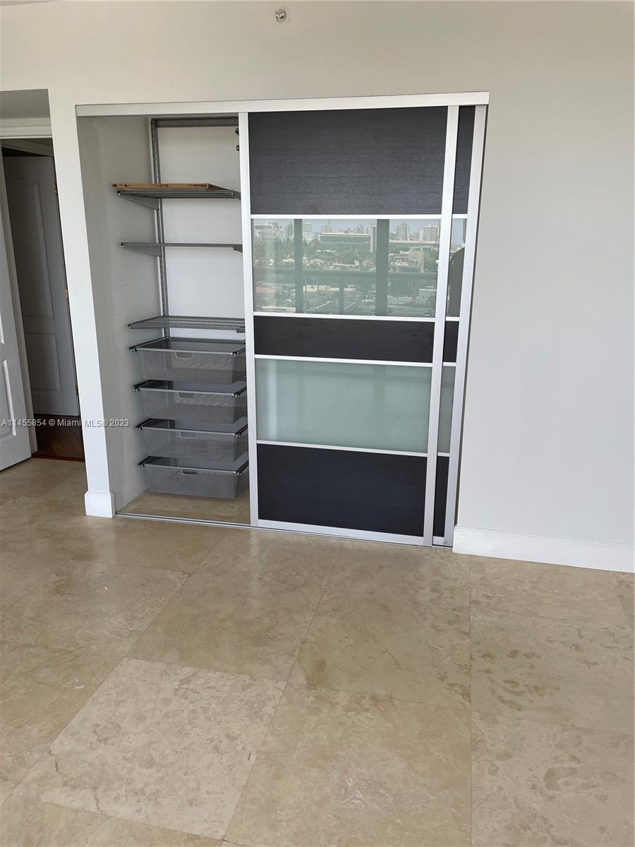 1900 Sunset Harbour Drive, Unit 1209 Miami Beach, FL 33139 - Photo 16 of 35 a view of an empty room with a fireplace