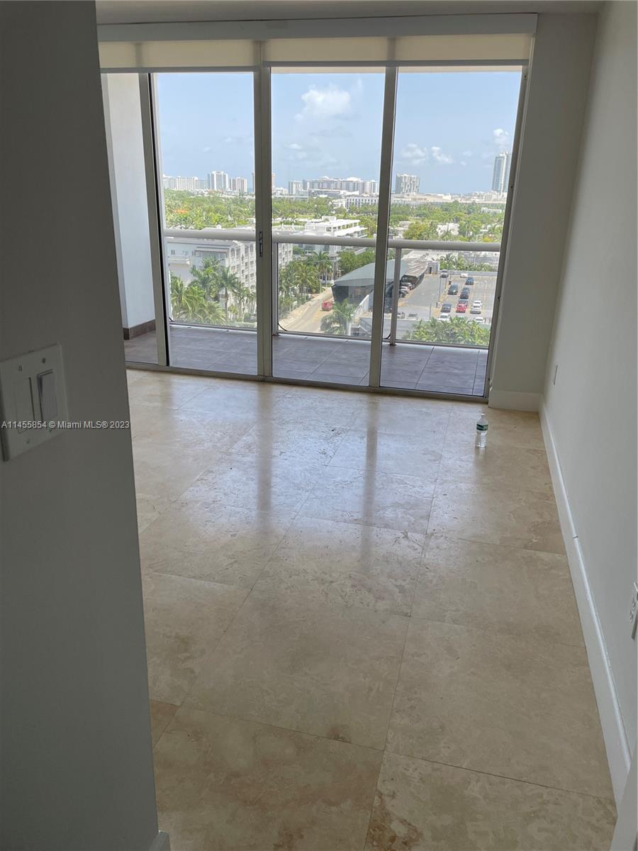1900 Sunset Harbour Drive, Unit 1209 Miami Beach, FL 33139 - Photo 17 of 35 a view of an empty room with a large window