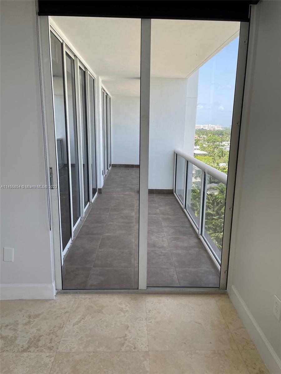 1900 Sunset Harbour Drive, Unit 1209 Miami Beach, FL 33139 - Photo 21 of 35 a view of a hallway with wooden floor