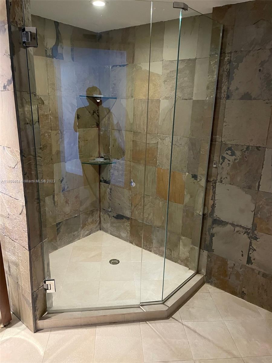 1900 Sunset Harbour Drive, Unit 1209 Miami Beach, FL 33139 - Photo 33 of 35 a bathroom with a shower
