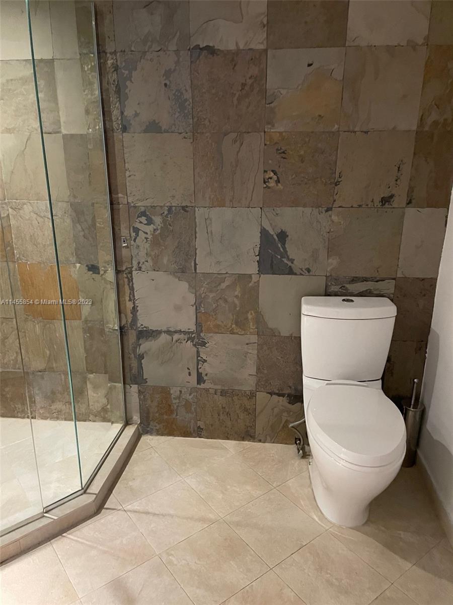 1900 Sunset Harbour Drive, Unit 1209 Miami Beach, FL 33139 - Photo 35 of 35 a white toilet sitting next to a shower
