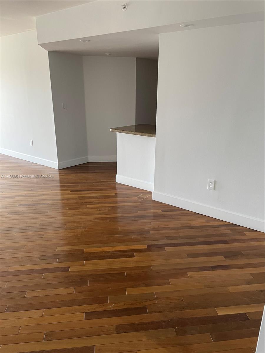 1900 Sunset Harbour Drive, Unit 1209 Miami Beach, FL 33139 - Photo 4 of 35 a view of room and wooden floor