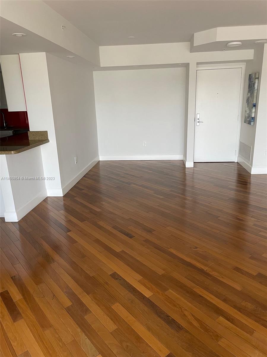 1900 Sunset Harbour Drive, Unit 1209 Miami Beach, FL 33139 - Photo 6 of 35 a view of a livingroom with wooden floor