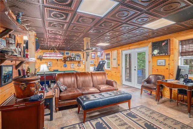 a room with pool table and a chandelier