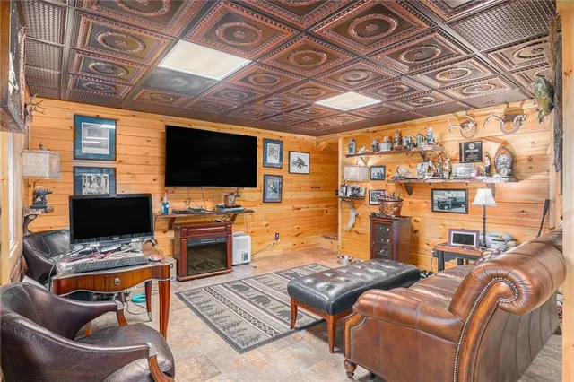 a room with pool table and windows