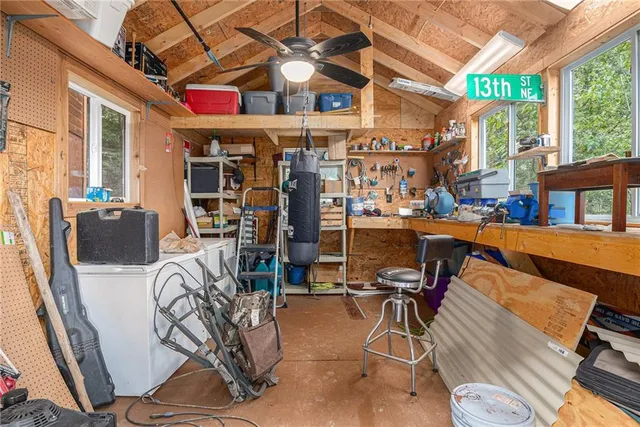 a view of a yard with wooden fence