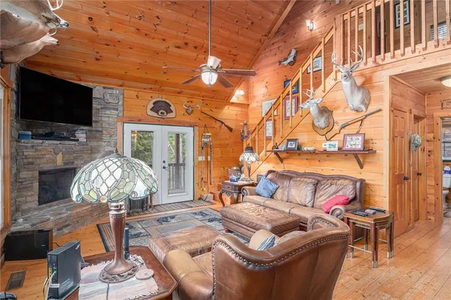 a bedroom with furniture and a flat screen tv