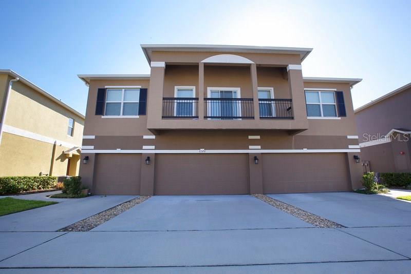6570 South Goldenrod Road, Unit B Orlando, FL 32822 - Photo 1 of 1 a front view of a house with a yard and garage