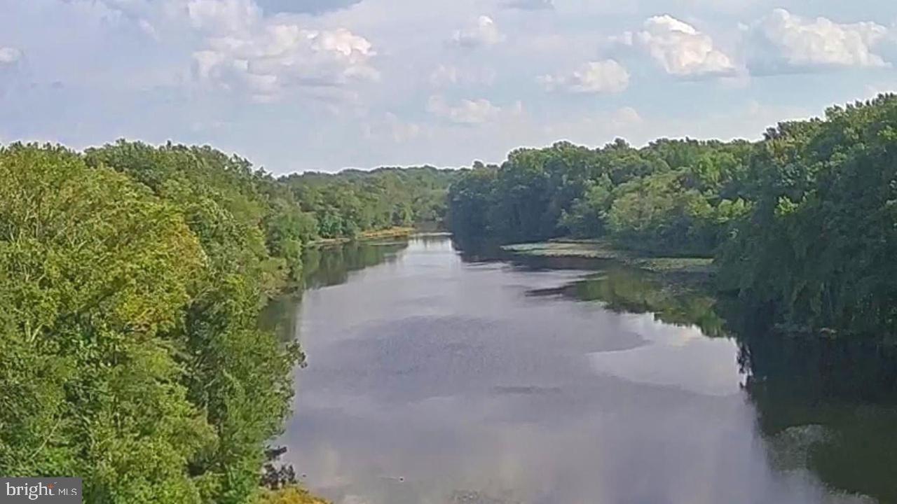 337 Ewan Road Mullica Hill, NJ 08062 - Photo 22 of 24 a view of a lake with houses in back