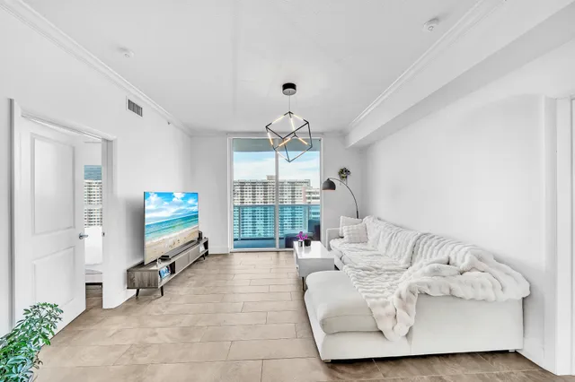 a living room with furniture and a large window