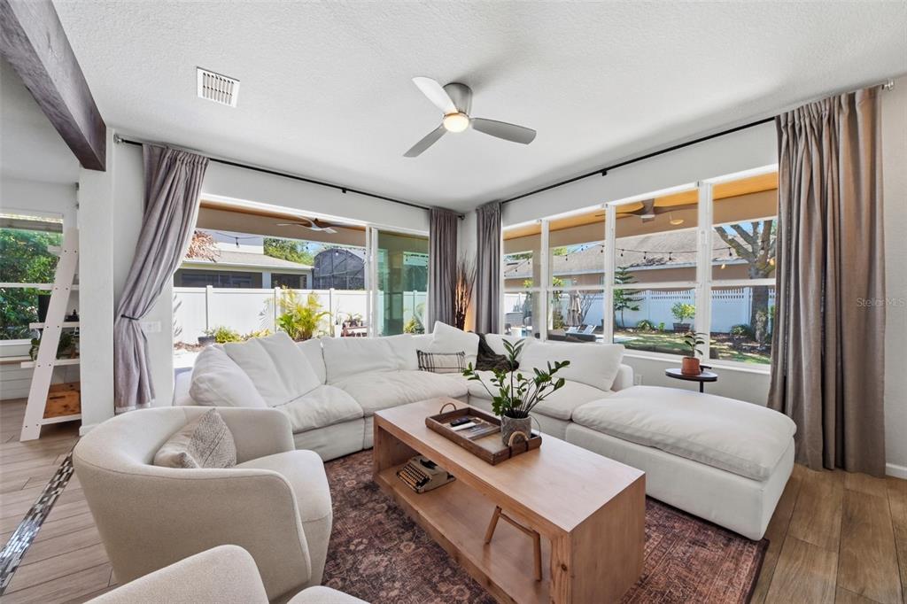 7519 Brofield Avenue Windermere, FL 34786 - Photo 13 of 49 a living room with furniture and a large window