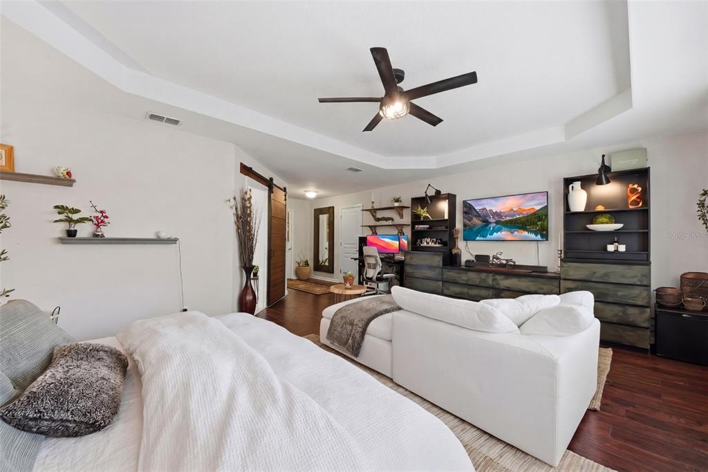 7519 Brofield Avenue Windermere, FL 34786 - Photo 21 of 49 a bedroom with a bed and a flat screen tv