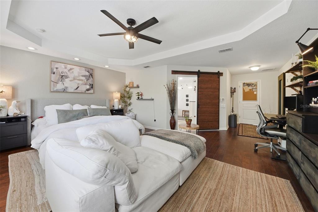 7519 Brofield Avenue Windermere, FL 34786 - Photo 22 of 49 a bedroom with a large bed and a large window