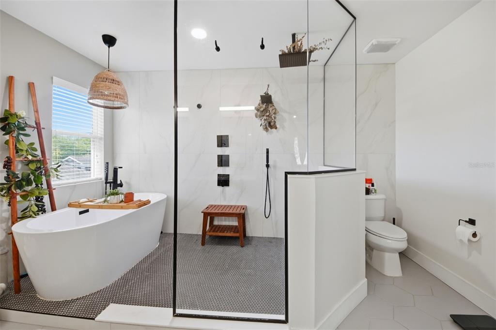 7519 Brofield Avenue Windermere, FL 34786 - Photo 24 of 49 a bathroom with a sink a toilet and a shower