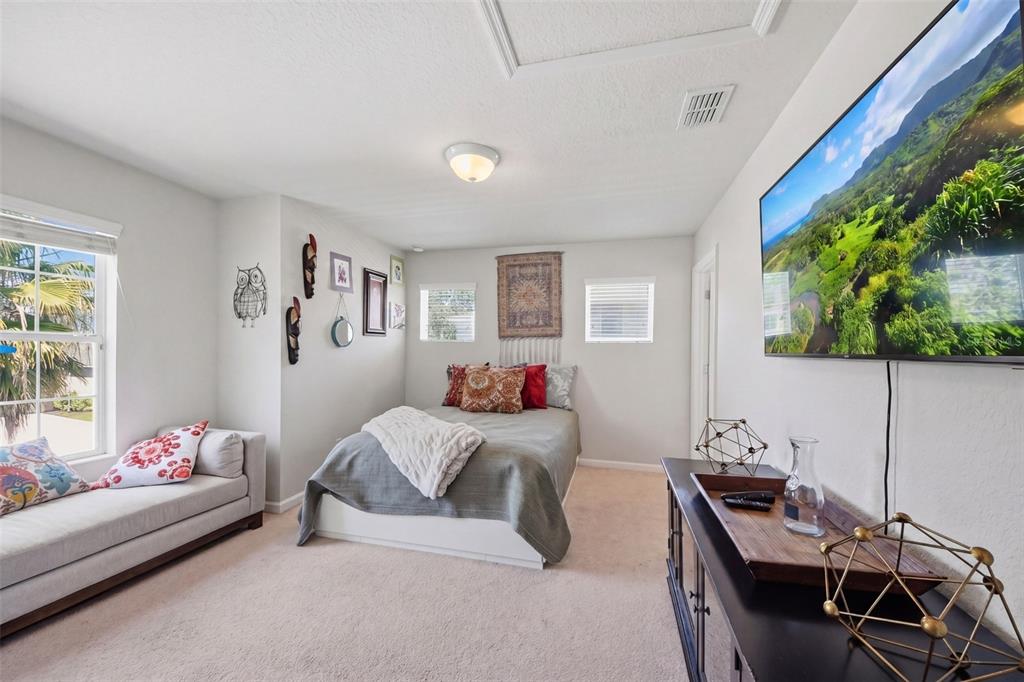 7519 Brofield Avenue Windermere, FL 34786 - Photo 26 of 49 a bedroom with furniture and a window