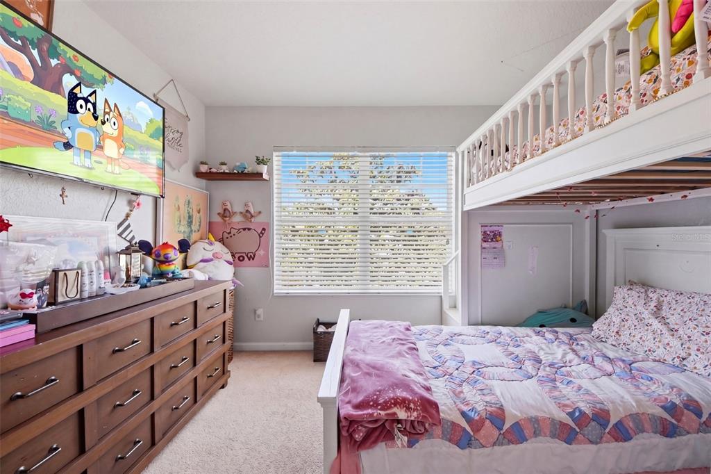 7519 Brofield Avenue Windermere, FL 34786 - Photo 32 of 49 a bedroom with a bed and a dresser in it