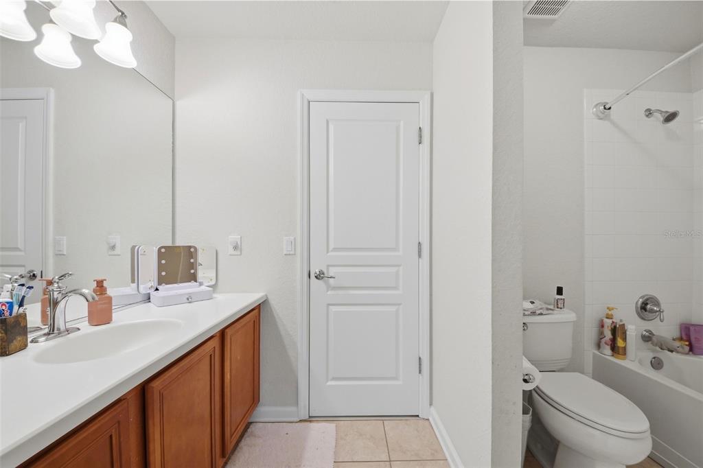 7519 Brofield Avenue Windermere, FL 34786 - Photo 33 of 49 a bathroom with a sink a toilet and vanity