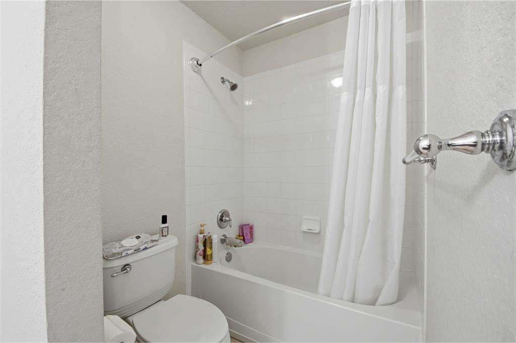 7519 Brofield Avenue Windermere, FL 34786 - Photo 34 of 49 a white toilet sitting next to a bath tub