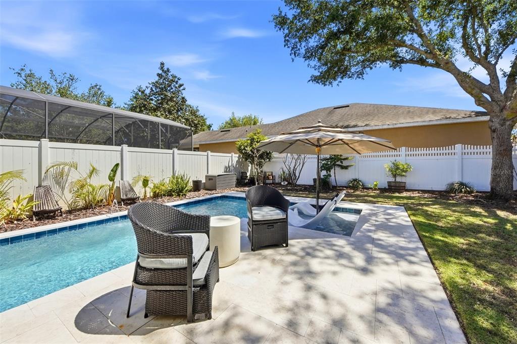 7519 Brofield Avenue Windermere, FL 34786 - Photo 37 of 49 a view of a backyard with sitting area