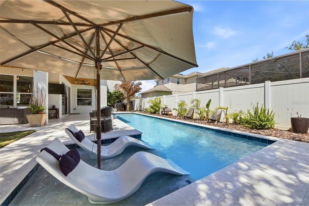 7519 Brofield Avenue Windermere, FL 34786 - Photo 38 of 49 a view of a swimming pool with a patio