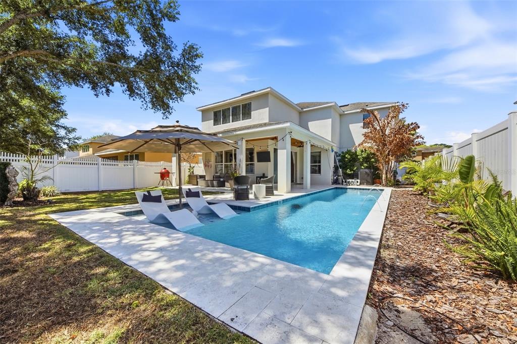7519 Brofield Avenue Windermere, FL 34786 - Photo 39 of 49 a view of a house with swimming pool and sitting area