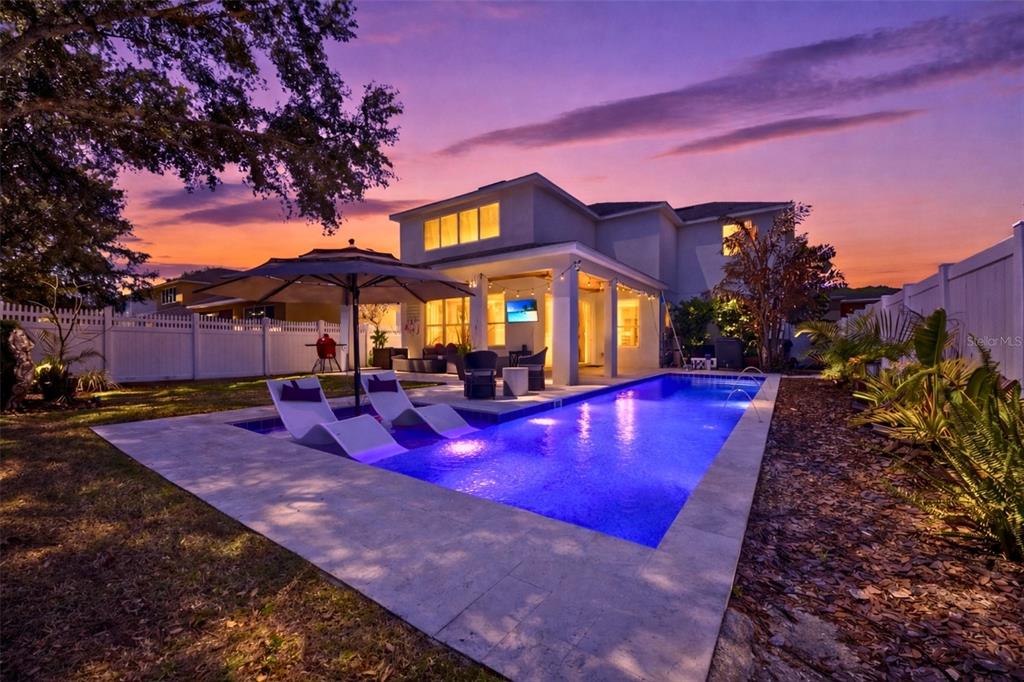 7519 Brofield Avenue Windermere, FL 34786 - Photo 40 of 49 a view of a swimming pool with an outdoor space and seating area