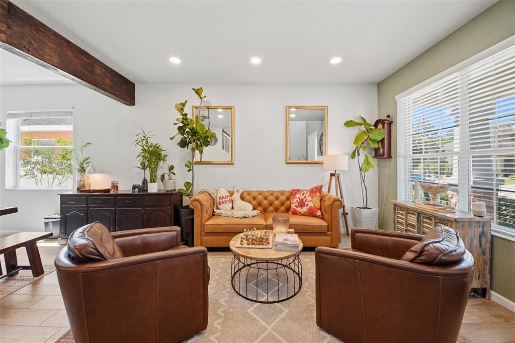 7519 Brofield Avenue Windermere, FL 34786 - Photo 6 of 49 a living room with furniture and a potted plant