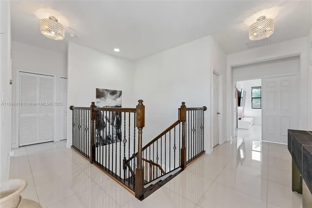a bathroom with a toilet sink vanity and mirror