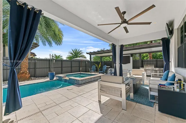 a view of a house with backyard and porch