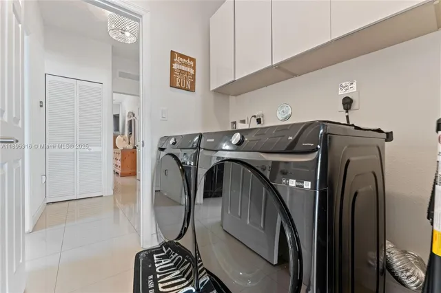 a kitchen with stainless steel appliances kitchen island granite countertop a sink and cabinets