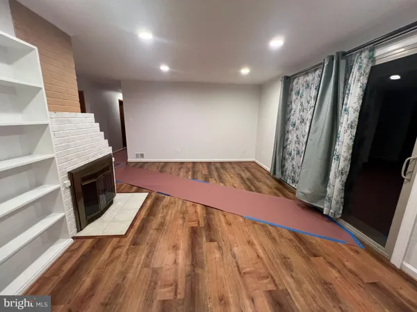 wooden floor with a rug