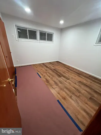 a view of a big room with wooden floor