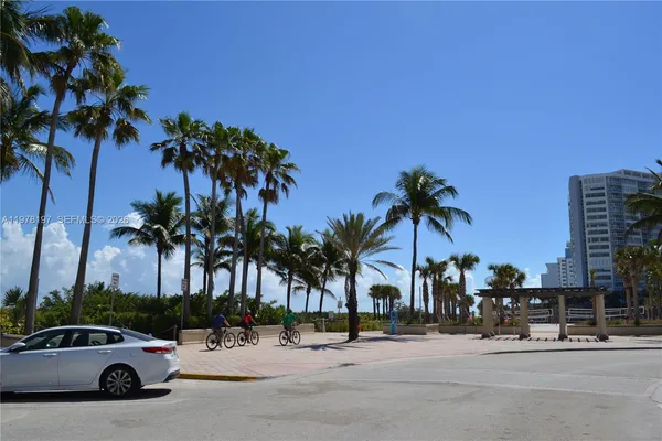a view of a street with cars