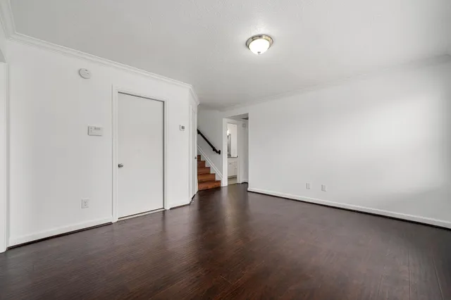 a view of a livingroom with wooden floor