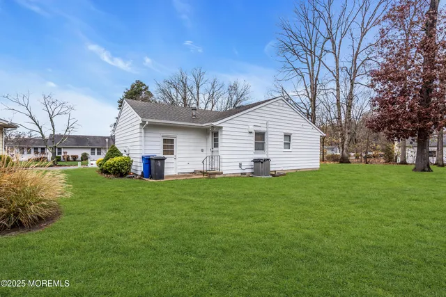 a view of room with stairs and mirrors