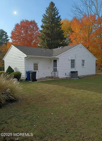 a view of room with stairs and mirrors