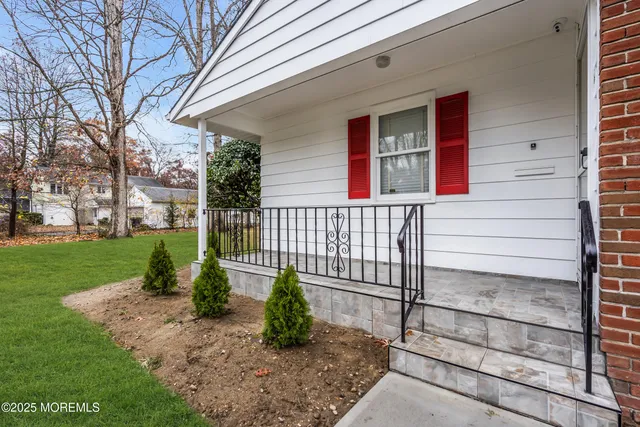 a bathroom with a sink a toilet and shower curtain