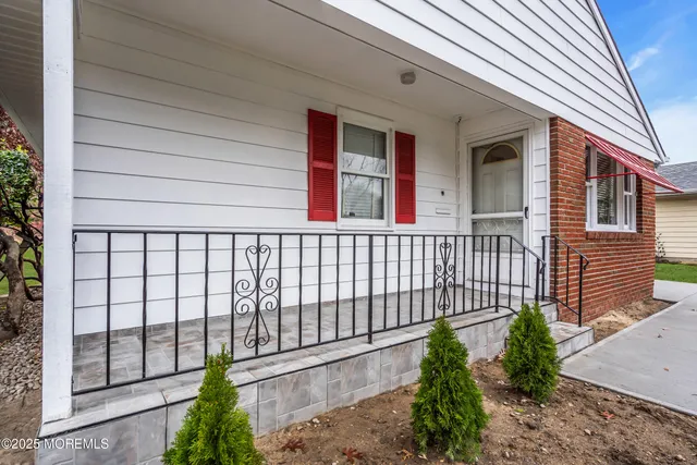 a bathroom with a sink vanity granite and toilet