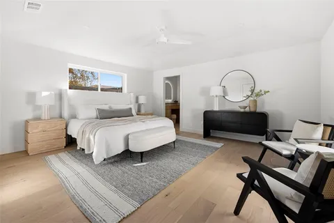 a bedroom with bed and a couch