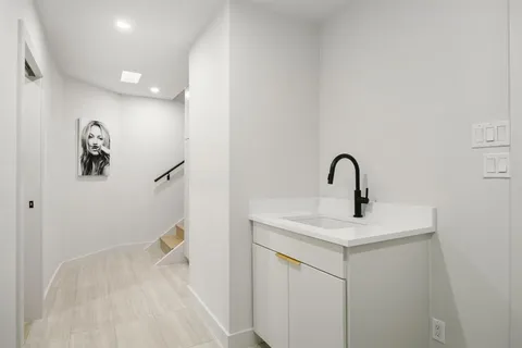 a view of a house with backyard and a garage