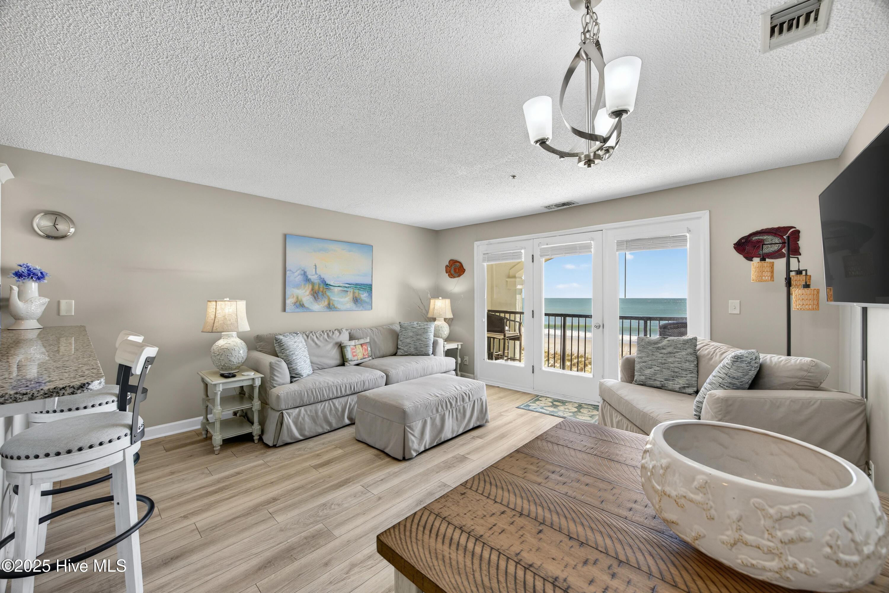 790 New River Inlet Road, Unit 115A North Topsail Beach, NC 28460 - Photo 8 of 40 Living room with ocean view