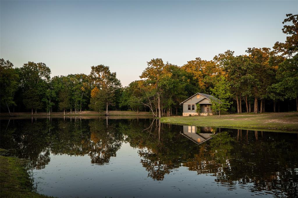 a view of a lake with a house in the background