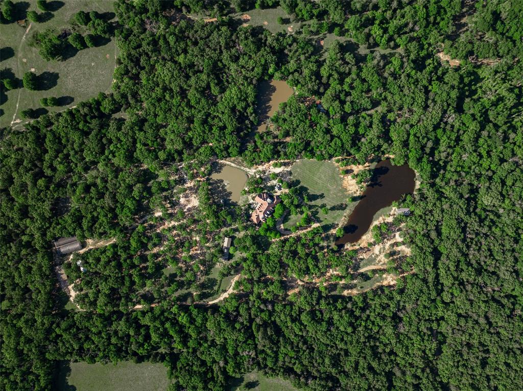 0 County Road 2402 Canton, TX 75103 - Photo 30 of 36 an aerial view of residential house with outdoor space and trees all around