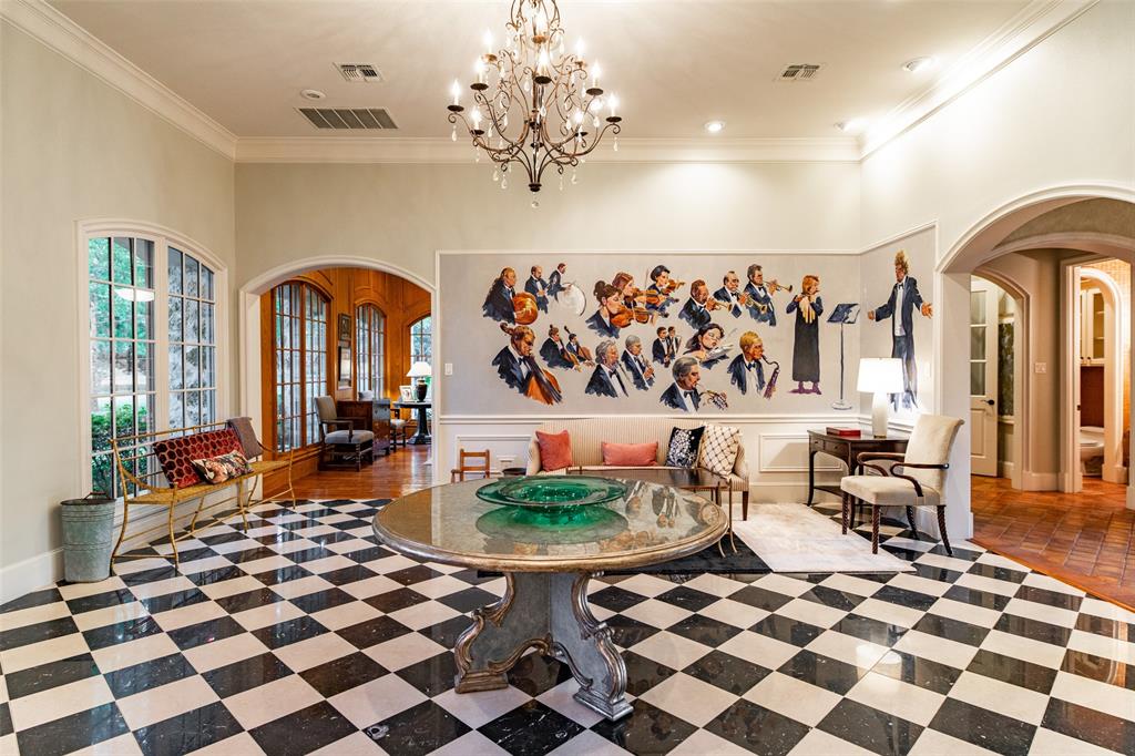 0 County Road 2402 Canton, TX 75103 - Photo 4 of 36 a living room with a black white checkered floor with a gaming machine and dining chairs
